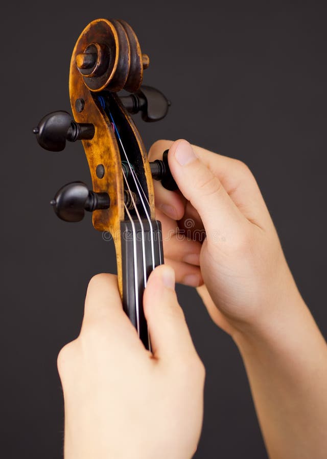 Tuning violin stock photography