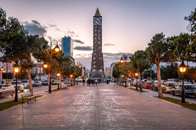 Habib Bourguiba Avenue with the clock tower at the endб Tunis, Tunisia. Habib Bourguiba Avenue with the clock tower at the endб Tunis, Tunisia