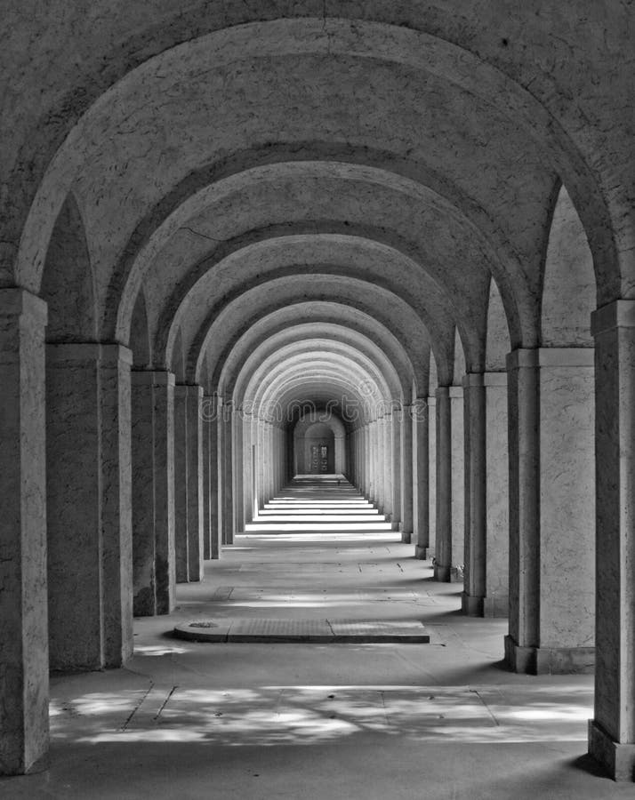 This is a long tunnel in black and white.