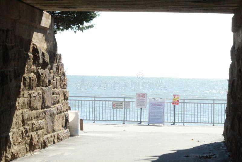 Through this tunnel, walk through, there is a beach called `the hole in the wall beach,  In Lyme, Connecticut.  Picnic areas, wooded areas, to explore, unwind, find peace, namaste, enjoyment, day off, take a break, have fun
swim, and catch some sun rays, picnic on the beach,. Through this tunnel, walk through, there is a beach called `the hole in the wall beach,  In Lyme, Connecticut.  Picnic areas, wooded areas, to explore, unwind, find peace, namaste, enjoyment, day off, take a break, have fun
swim, and catch some sun rays, picnic on the beach,