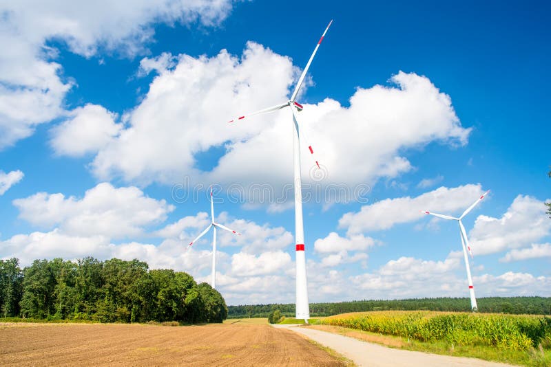 Turbines on field on cloudy blue sky stock photos Turbines on field on cloudy blue sky stock photos