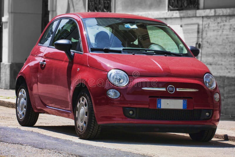Used red urban car model Fiat 500 produced by Italian Fiat automaker parked on the street stock photography Used red urban car model Fiat 500 produced by Italian Fiat automaker parked on the street stock photography
