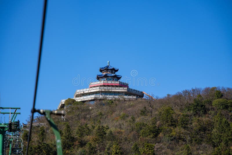 Tourists sitting on the cable car. Cable cars without protective glasses at Tianmenshan, Hunan province, Zhangjiajie. Tourists sitting on the cable car. Cable cars without protective glasses at Tianmenshan, Hunan province, Zhangjiajie.