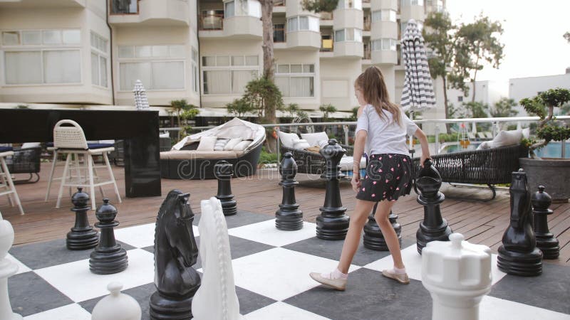 Turkey, Belek - May 20, 2019. Papilon Zeugma Hotel. Playing Outdoor Chess  Large Chess Pieces. Mother and Daughter Stock Video - Video of baby, dress:  160137023