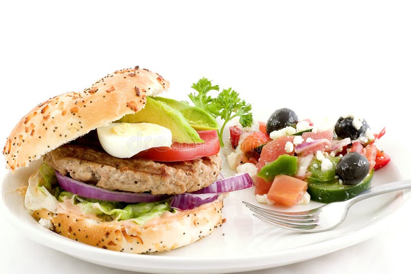 Turkey burger, greek salad stock image. Image of attractive 2017479