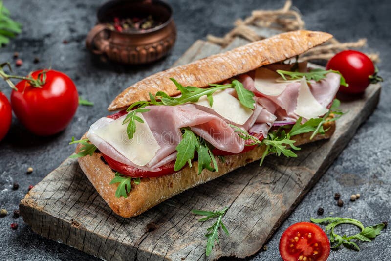 Turkey Sandwich with Ham, Tomato, Parmesan and Arugula. Appetizer Bruschetta Stock Image Image