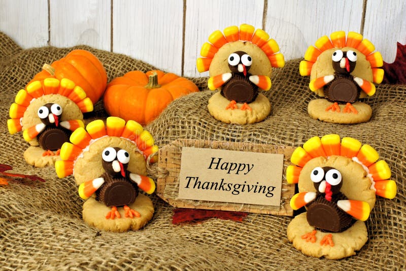 Turkey shaped cookies with Happy Thanksgiving card on burlap