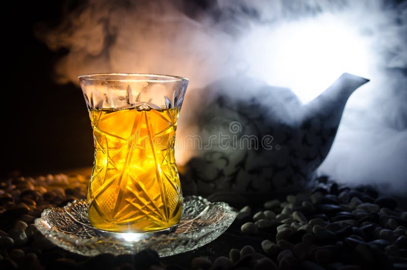 https://thumbs.dreamstime.com/b/turkish-azerbaijan-tea-traditional-glasse-pot-black-background-lights-smoke-armudu-traditional-cup-eastern-96192495.jpg
