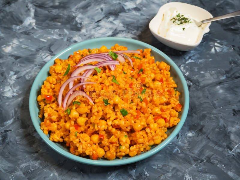 Turkish Bulgur Pilaf with Chickpeas and Tomatoes. Stock Photo Image