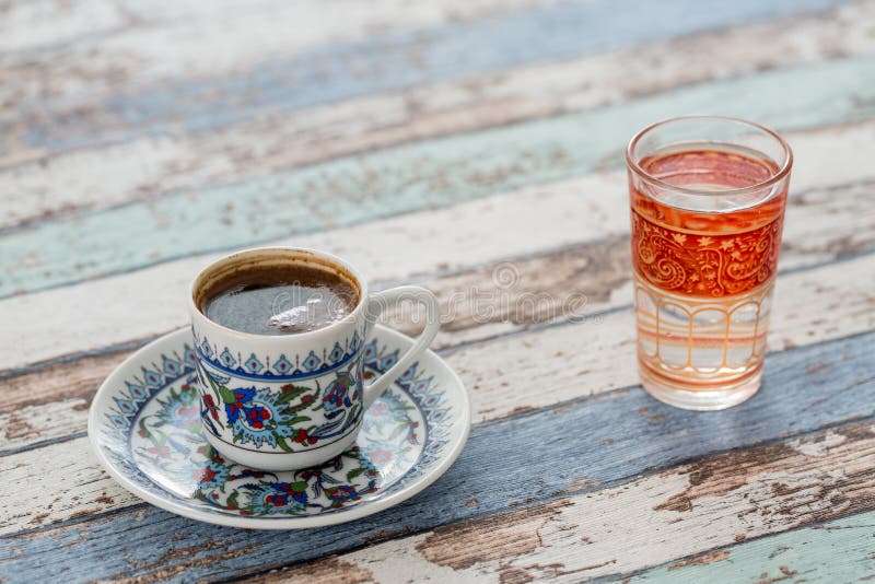 Turkish Coffee in Traditional Cup with Glass of Water Stock Photo