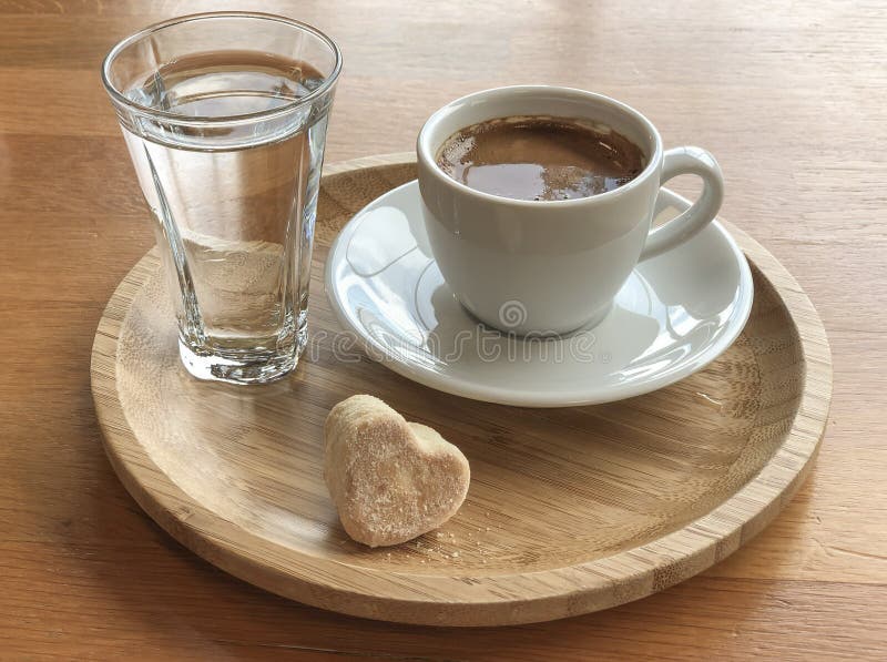 Turkish Coffee and Water Served with a Cookie Stock Photo Image of