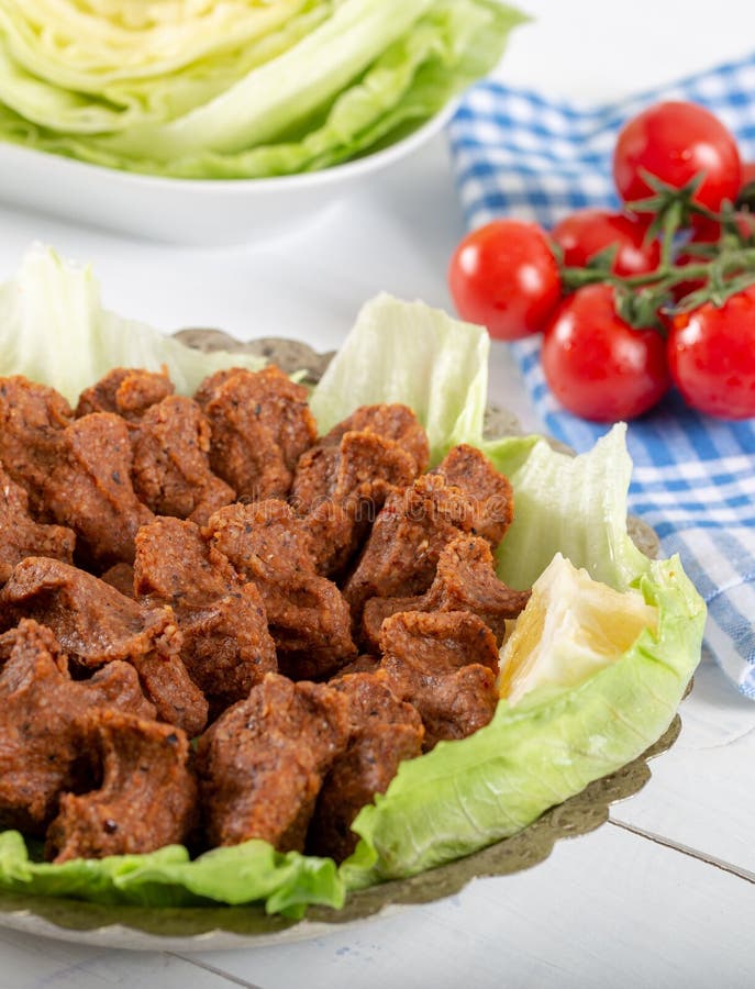 Turkish Food Cig Kofte with Lemon, Lettuce and Parsley on Silver Plate ...