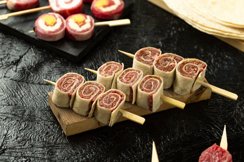 Turkish-style raw veal, skewered and ready for grilling with tortilla bread. stock images