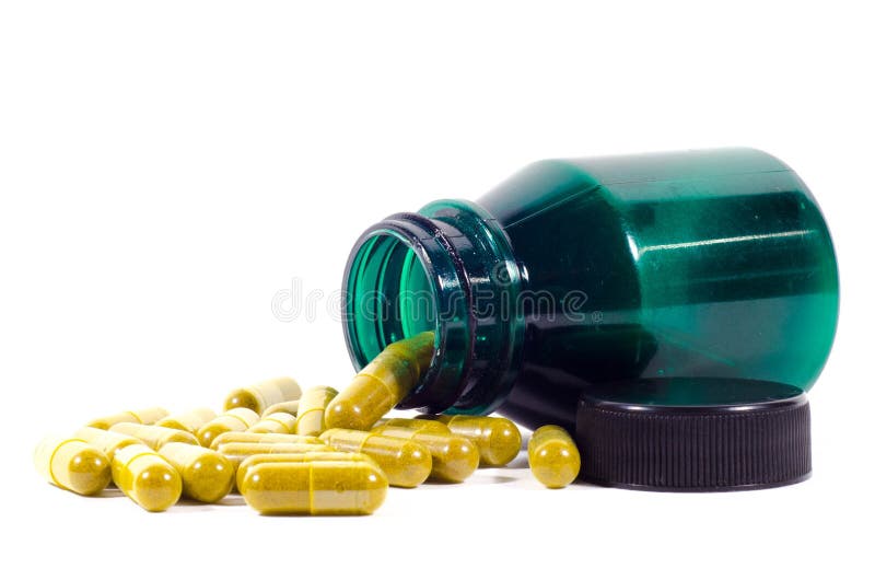 Green bottle with turmeric capsules on a white blackgro. Green herbal drug medicine stock images, royalty-free photos and pictures
