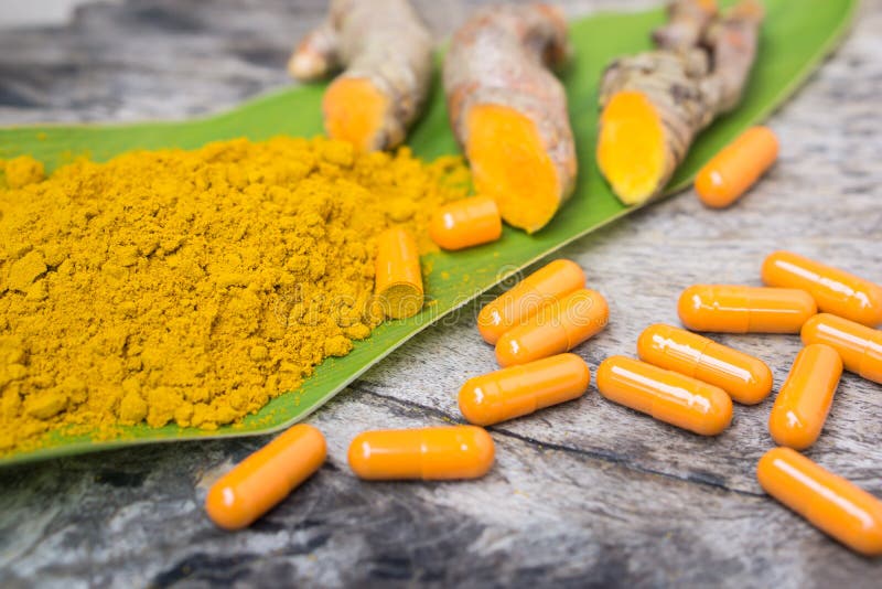 Turmeric powder ,capsules , roots and leaf, curcumin herb medicine