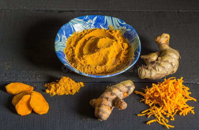 Turmeric Powder And Root On Black Rustic Background Stock Photo Image