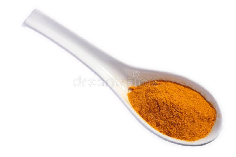 Turmeric powder on a spoon royalty free stock photography