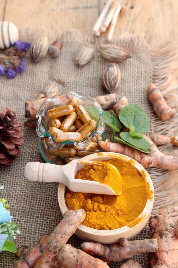 Turmeric Powder with Tumeric Capsules for Health. Stock Photo Image