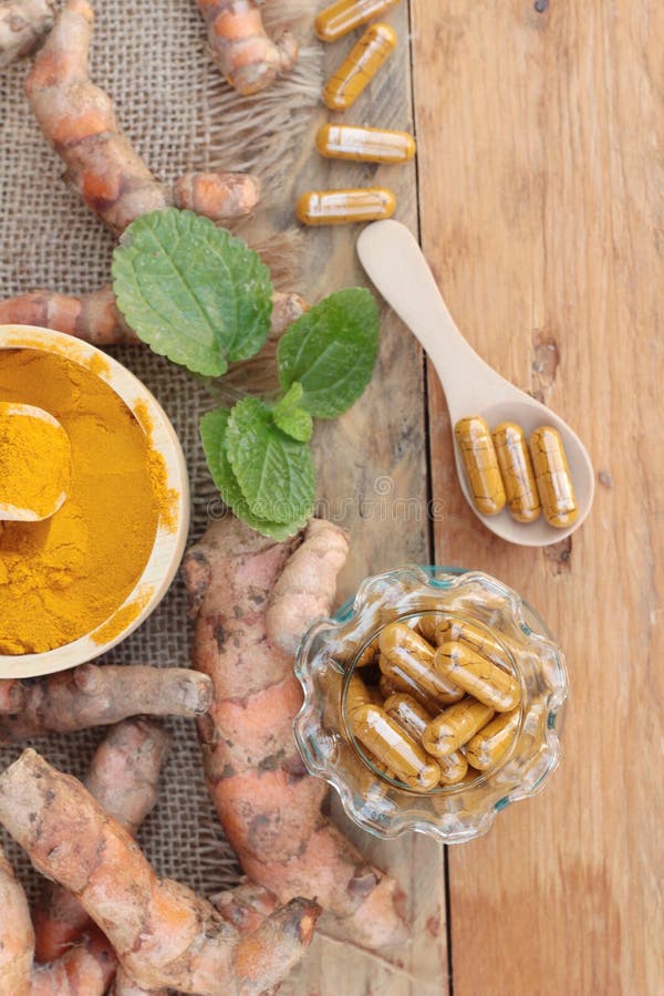 Turmeric Powder with Tumeric Capsules for Health. Stock Photo Image