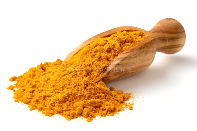 Turmeric powder in the wooden scoop, isolated on white background