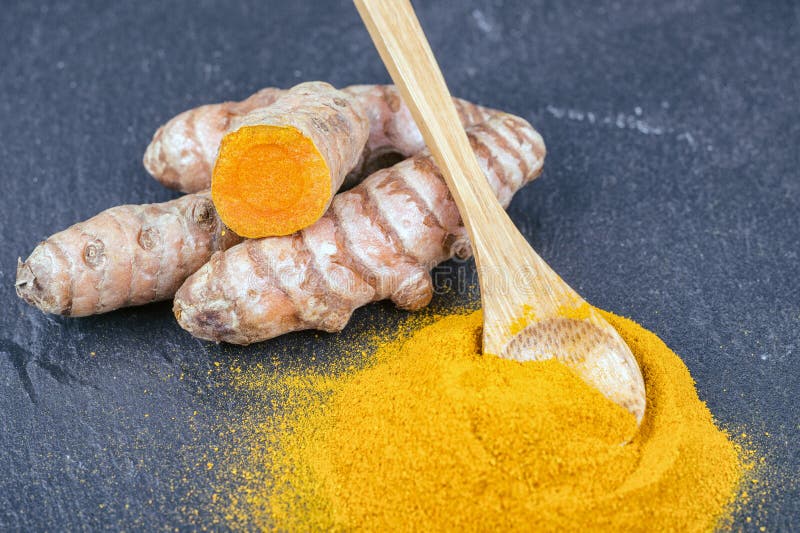 Turmeric roots and powder stock image. Image of root 77743029