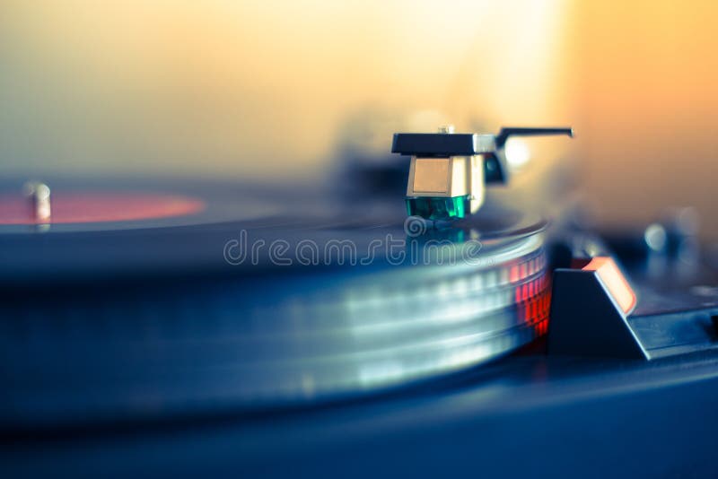 Close up picture of a record player, playing a record vinyl music retro vintage sound audio disc dj entertainment closeup studio sunshine nightclub recording streaming nobody classic musical needle stereo lp sunbeam effect object industry life instrument turnable technology passion old fashioned phonograph listen grunge song acoustic mixing ambient disco buttons jockey. Close up picture of a record player, playing a record vinyl music retro vintage sound audio disc dj entertainment closeup studio sunshine nightclub recording streaming nobody classic musical needle stereo lp sunbeam effect object industry life instrument turnable technology passion old fashioned phonograph listen grunge song acoustic mixing ambient disco buttons jockey