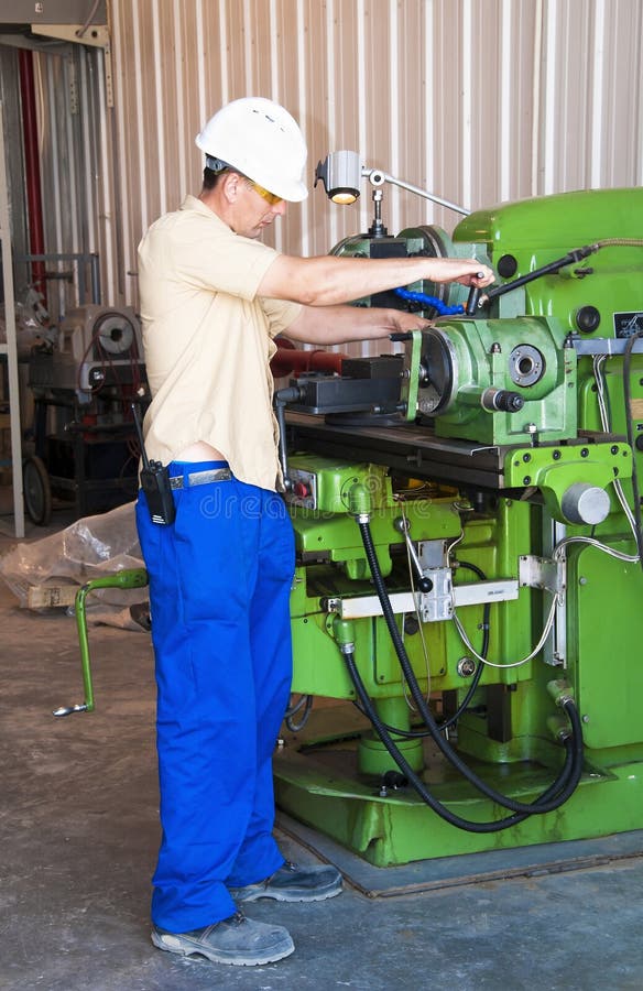 The Mechanic Dressed In Overalls, Works At The Boring Machine Stock