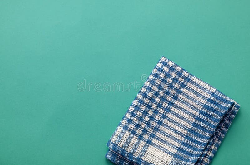 Turquoise Background with a White and Blue Kitchen Towel Stock Image
