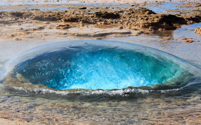 The turquoise blue boiling bubble of Strokkur Geyser before eruption. Gold Circle. Iceland.