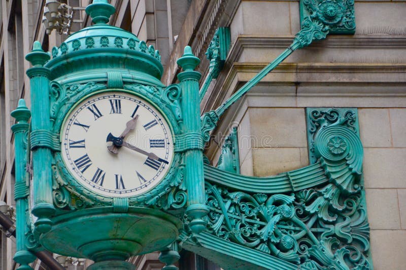 Turquoise clock on a building in Chicago