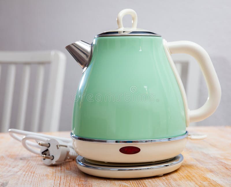 https://thumbs.dreamstime.com/b/turquoise-electric-tea-kettle-wooden-table-turquoise-electric-tea-kettle-wooden-table-water-boiler-heater-196823536.jpg