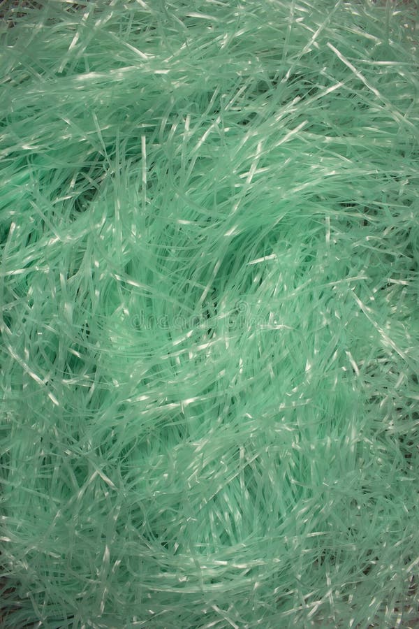 Turquoise Shredded Plastic Fake Easter Grass Background Stock Photo