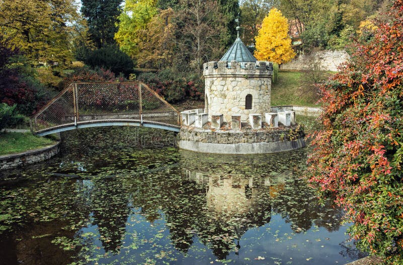 Turret in Bojnice, Slovakia, autumn park, seasonal colorful natural scene with lake