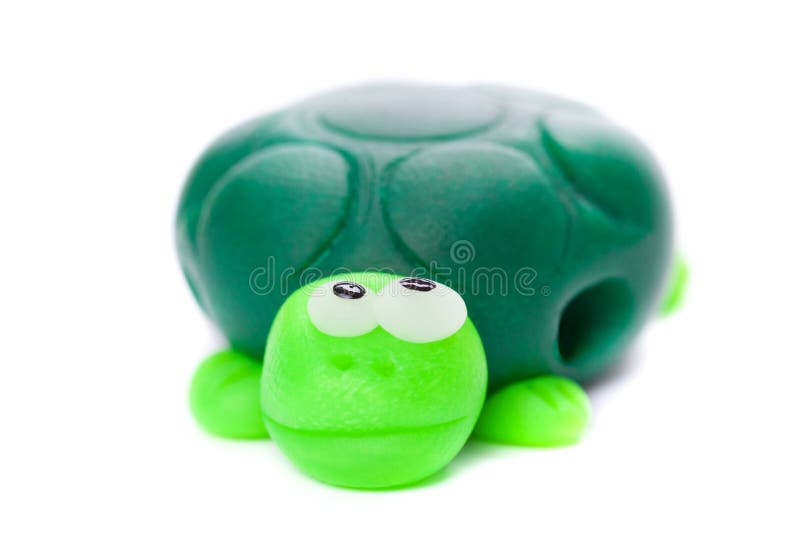 Turtle made of polymer clay isolated on white background