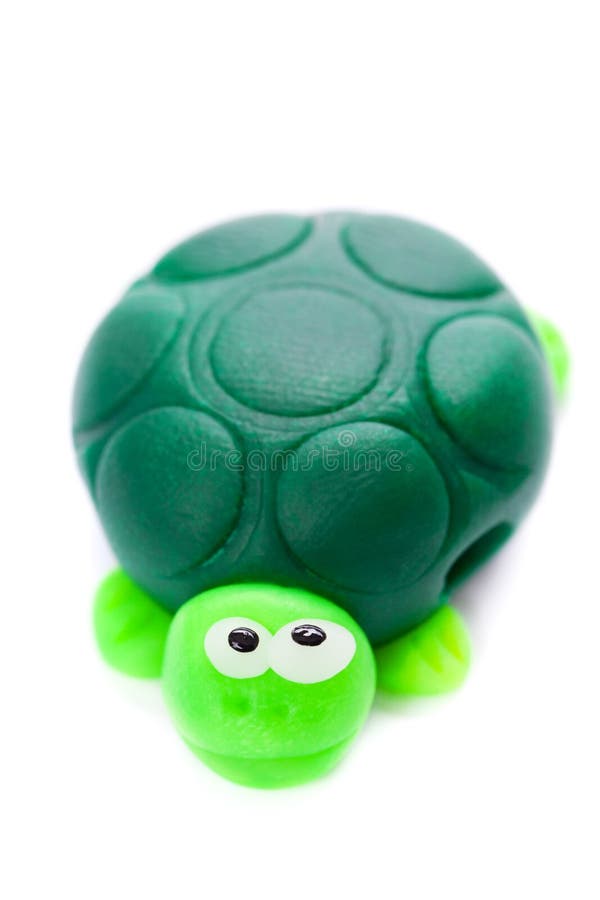 Turtle made of polymer clay isolated on white background