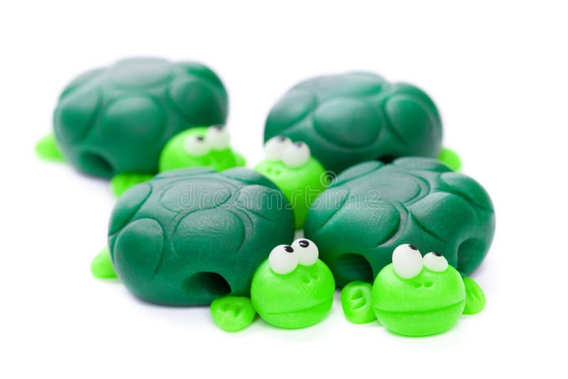 Turtles made of polymer clay isolated on white background
