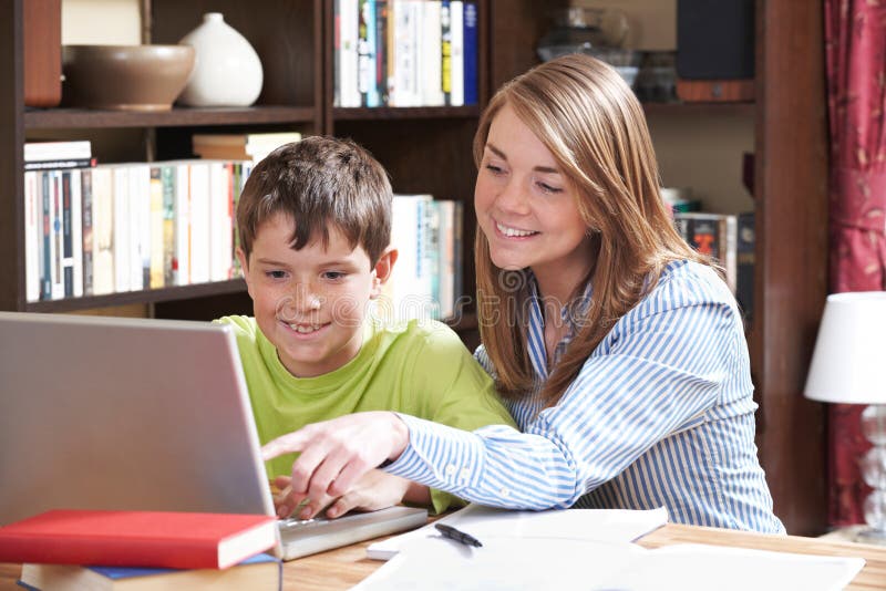 Tutor Helping Boy Studying At Home Stock Photo Image Of Child