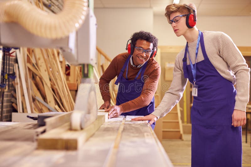 Male Student Studying For Carpentry Apprenticeship At College