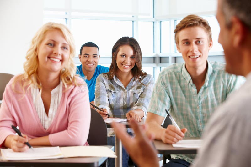 Tutor teaching class of students royalty free stock photos