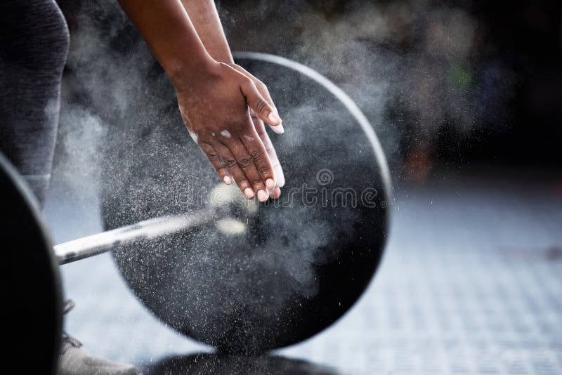 Everyone has the same 24 hours, make them count. An unrecognizable woman dusting her hands with powder before lifting weights. Everyone has the same 24 hours, make them count. An unrecognizable woman dusting her hands with powder before lifting weights