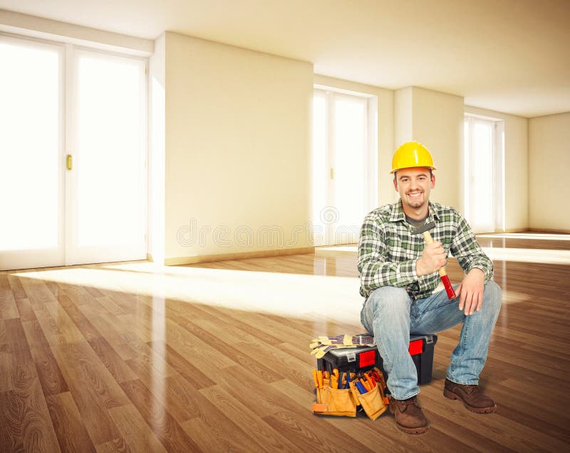 Smiling worker sit in empty house. Smiling worker sit in empty house