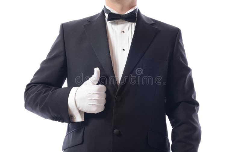 Man in tuxedo giving the thumbs up isolated on white. Man in tuxedo giving the thumbs up isolated on white