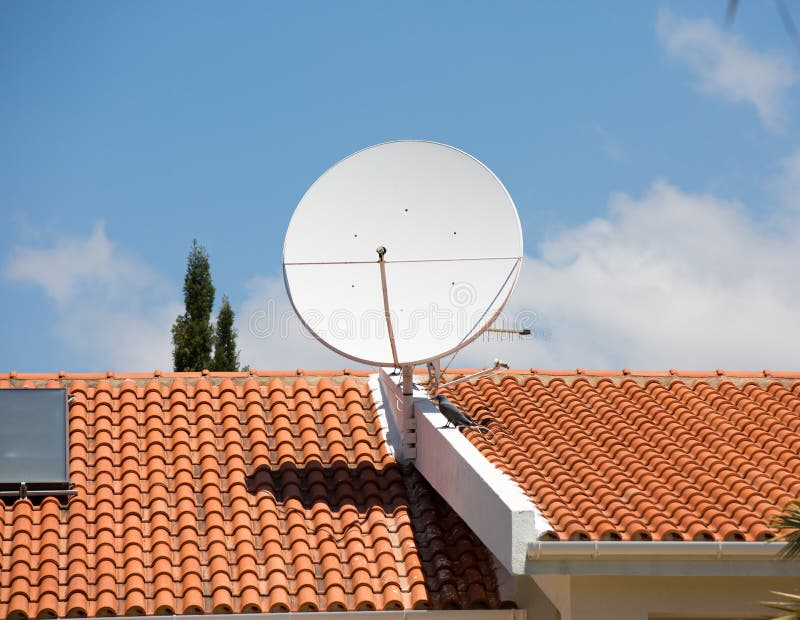 Tv antenna on the red tile roof