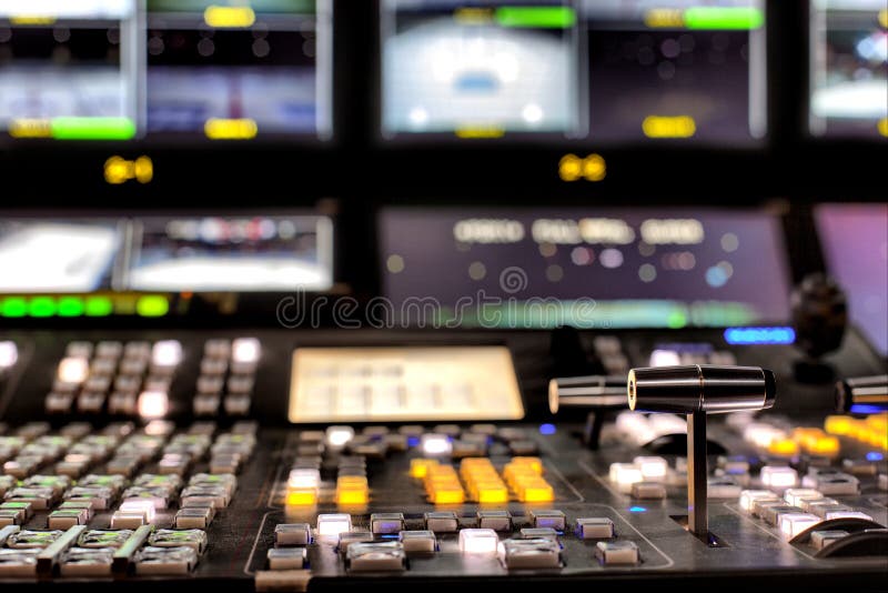 Wide shot of vision mixing panel in a television gallery. Wide shot of vision mixing panel in a television gallery.