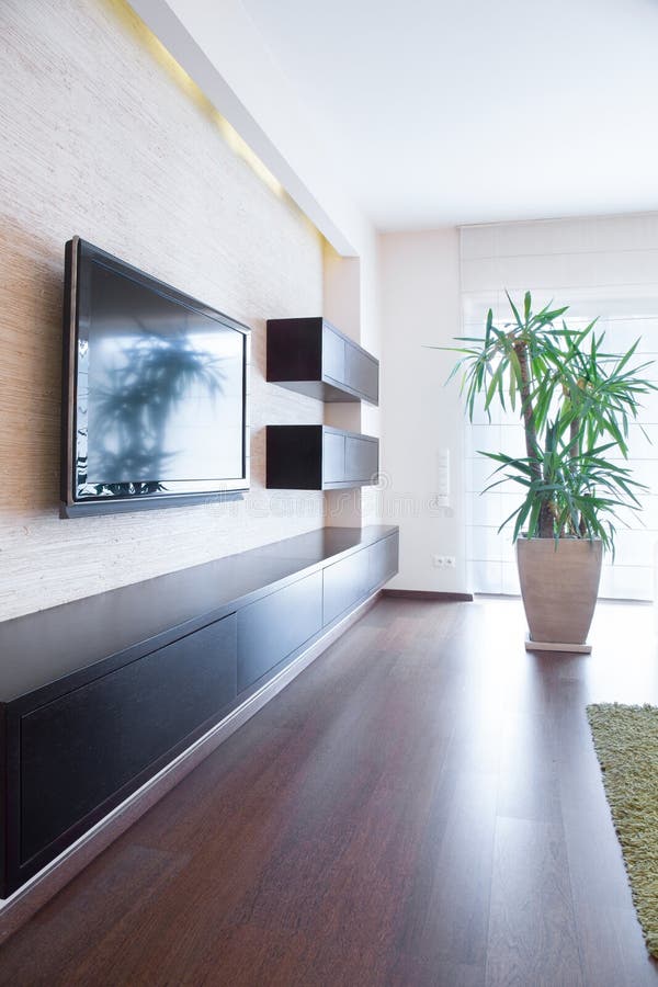 Tv on the wall inside room stock image. Image of flat 49510201