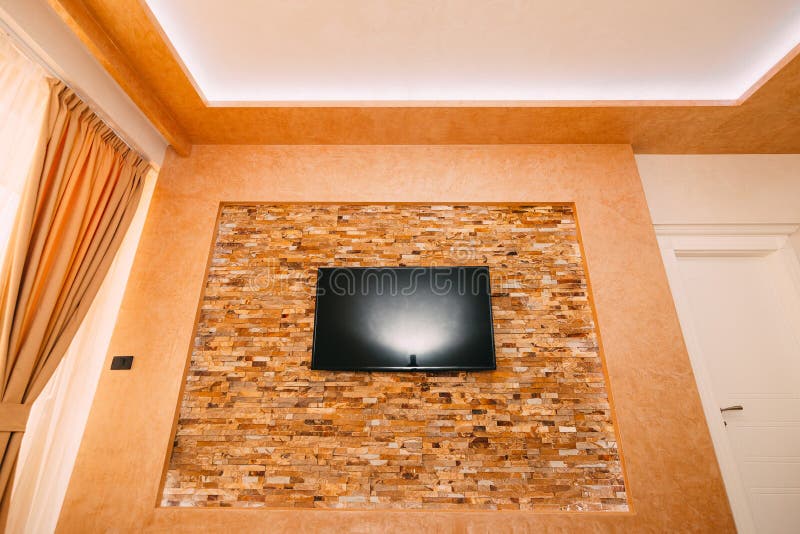 TV on the Wall. TV Hanging on the Wall Stock Photo Image of media