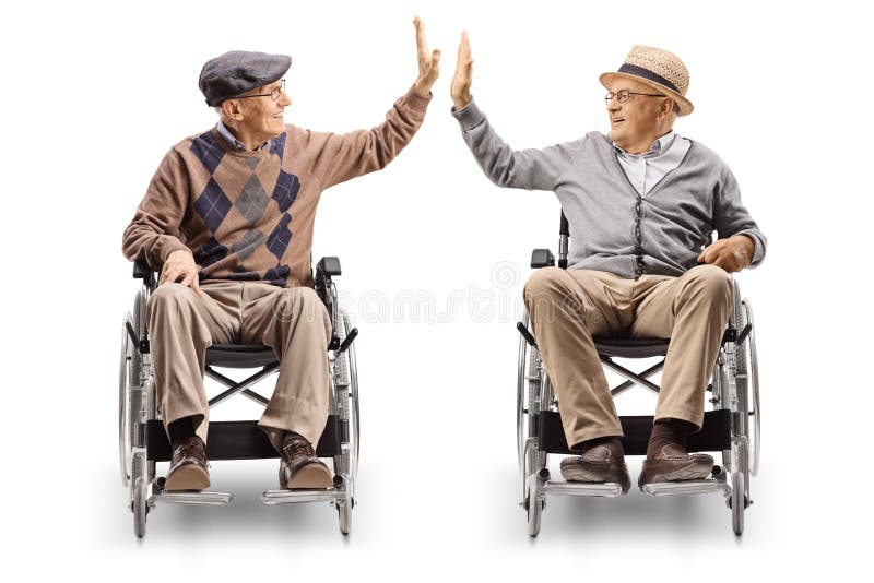 Two senior men in wheelchairs giving high-five isolated on white background. Two senior men in wheelchairs giving high-five isolated on white background