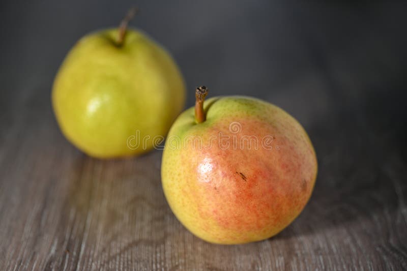 two juicy pears on a wooden table, studio shooting 4. two juicy pears on a wooden table, studio shooting 4