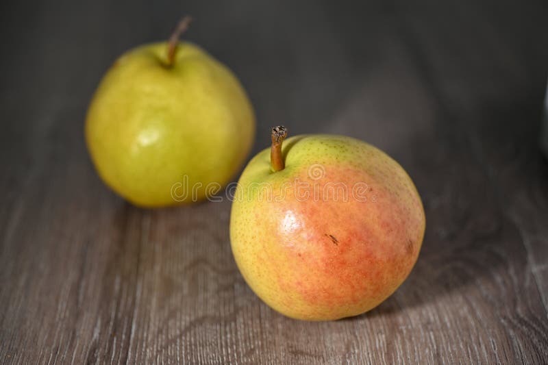 two juicy pears on a wooden table, studio shooting 3. two juicy pears on a wooden table, studio shooting 3