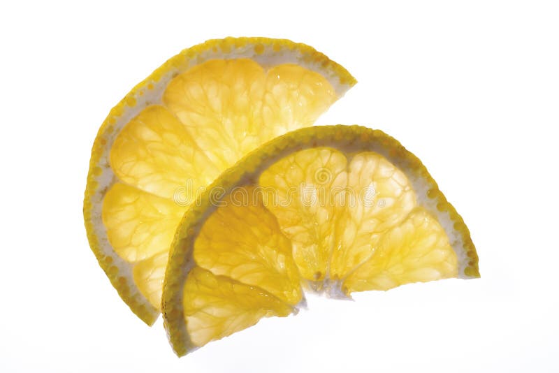 Två skivor av uglien (citrusfrukt), höjd sikt, närbild arkivbilder Två skivor av uglien (citrusfrukt), höjd sikt, närbild arkivbilder
